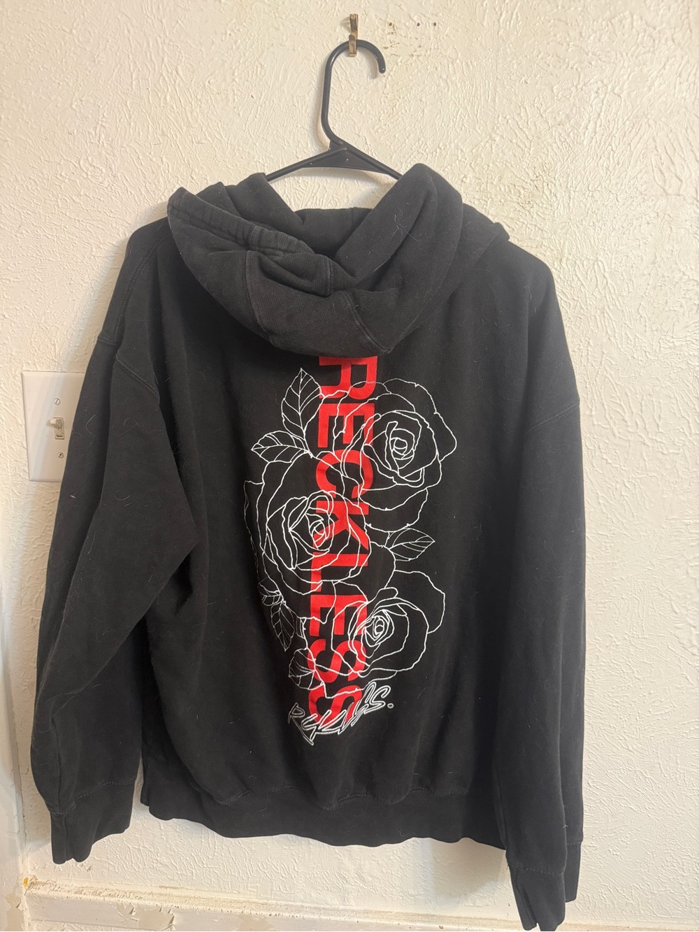 Young and Reckless Black Graphic Hoodie with Red Rose Print